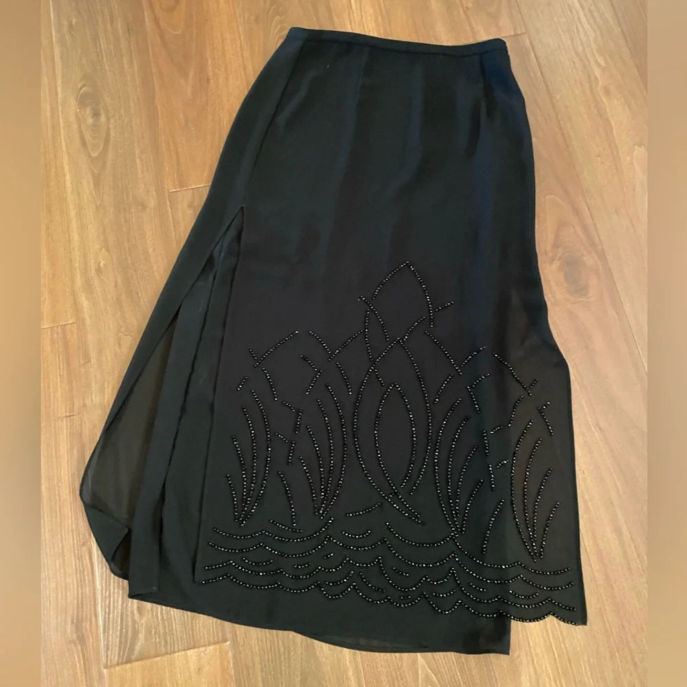 Dress barn size 14 lined and embellished black skirt with side slit